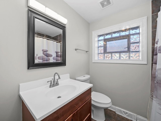 417 Oglesby Ave, Calumet City, IL 60409 - bathroom with tile patterned floors, toilet, visible vents, and vanity