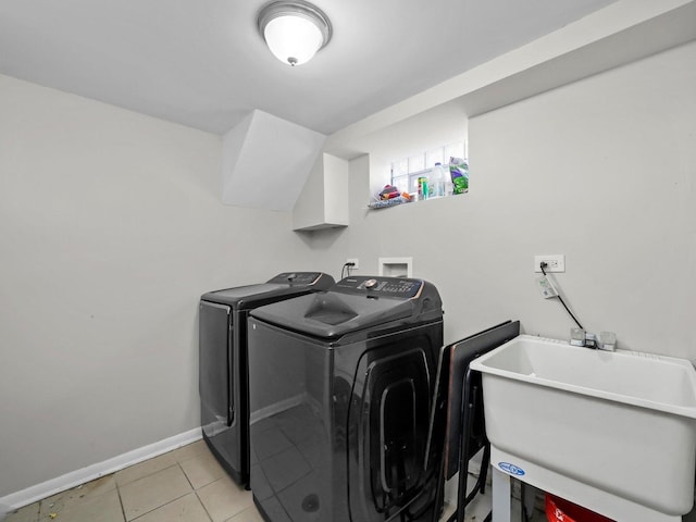 417 Oglesby Ave, Calumet City, IL 60409 - laundry area featuring washing machine and dryer, light tile patterned floors, a sink, laundry area, and baseboards
