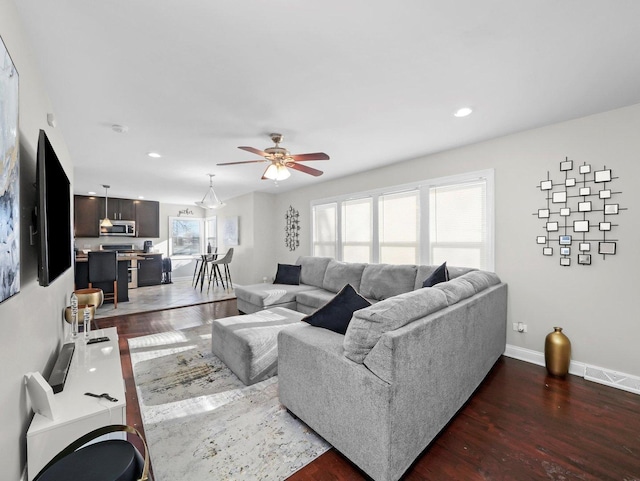 417 Oglesby Ave, Calumet City, IL 60409 - living room with dark wood-style flooring, baseboards, ceiling fan, and recessed lighting
