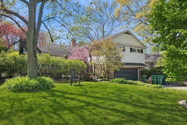342 Ingram St, Northfield, IL 60093 - view of front of home featuring an attached garage, a front lawn, and a chimney