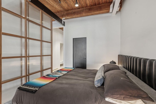 bedroom with wood ceiling and beamed ceiling