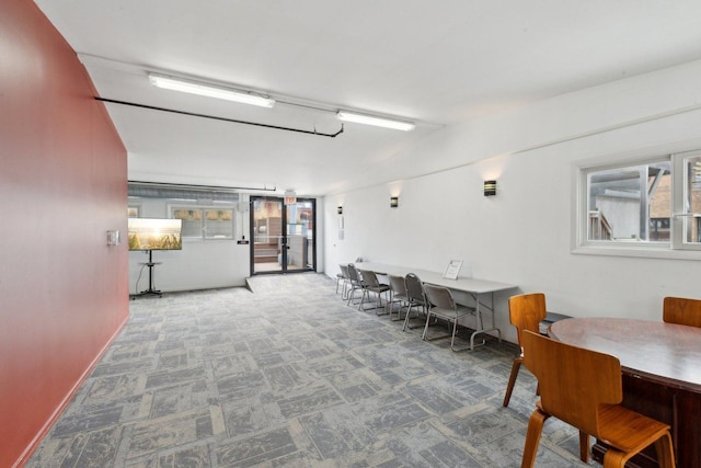 carpeted dining space with healthy amount of natural light