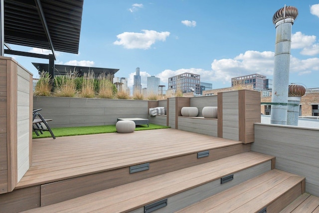 wooden terrace with a city view