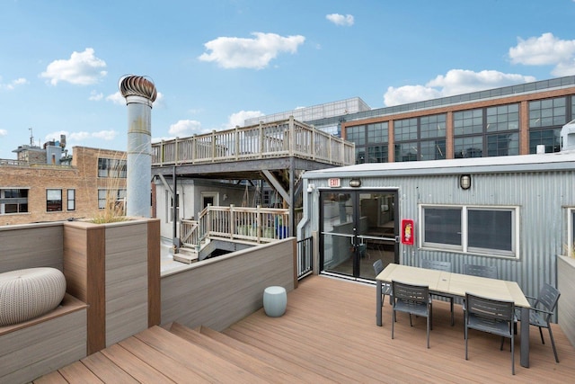 deck with outdoor dining area
