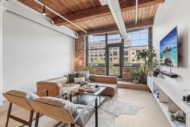 sunroom featuring beamed ceiling