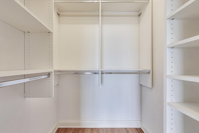 spacious closet with wood finished floors