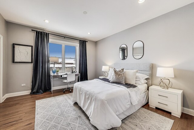bedroom featuring baseboards, wood finished floors, a desk, and recessed lighting