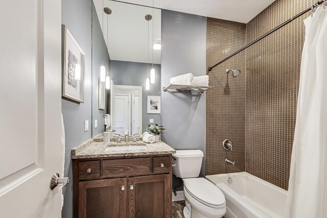 full bathroom featuring shower / bath combination with curtain, toilet, and vanity