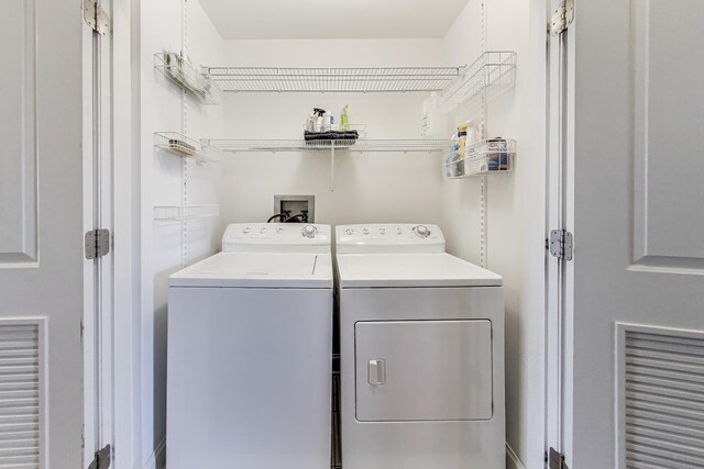 washroom featuring independent washer and dryer
