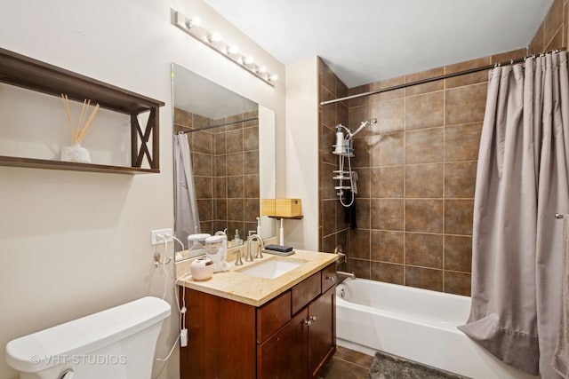 full bath featuring shower / bath combo with shower curtain, tile patterned flooring, toilet, and vanity