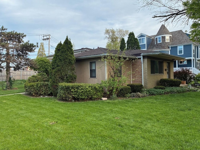 view of side of home with brick siding