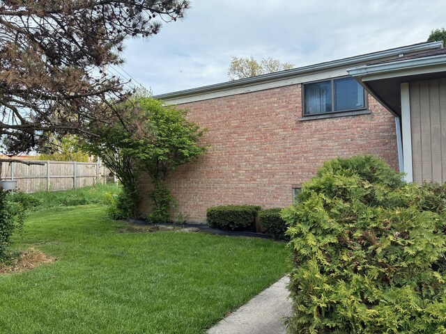 view of property exterior with brick siding