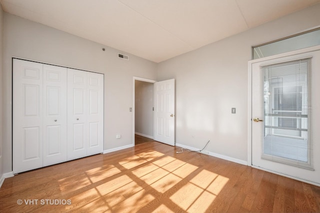 3115 Town Square Dr Unit 303, Rolling Meadows, IL 60008 - unfurnished bedroom with light wood-style floors, baseboards, and a closet