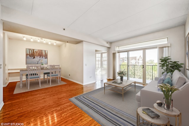 3115 Town Square Dr Unit 303, Rolling Meadows, IL 60008 - living area with baseboards, track lighting, and wood finished floors