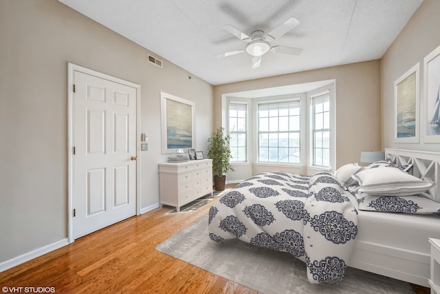 3115 Town Square Dr Unit 303, Rolling Meadows, IL 60008 - bedroom with light wood-style floors, baseboards, and a ceiling fan