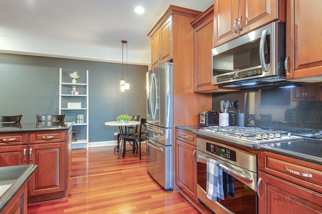 893 S Plum Grove Rd, Palatine, IL 60067 - kitchen featuring appliances with stainless steel finishes, dark countertops, light wood-style floors, and recessed lighting