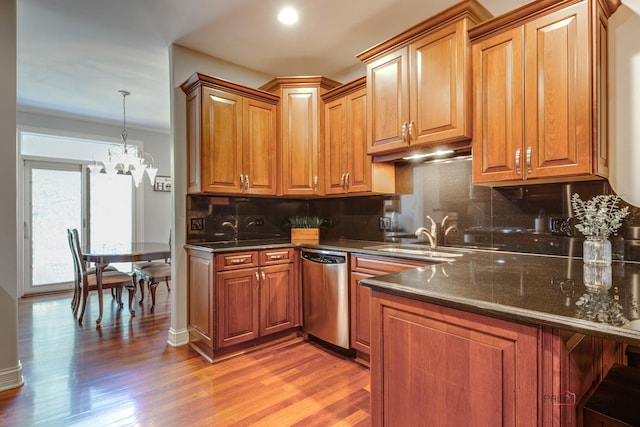 893 S Plum Grove Rd, Palatine, IL 60067 - kitchen featuring stainless steel dishwasher, a sink, tasteful backsplash, light wood-style floors, and a chandelier