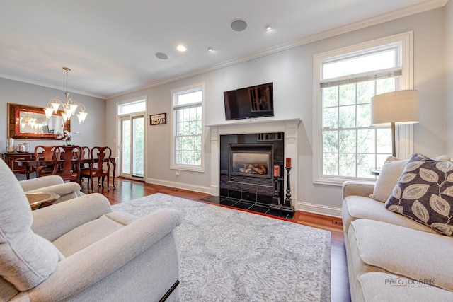 893 S Plum Grove Rd, Palatine, IL 60067 - living area featuring dark wood-style flooring, crown molding, a chandelier, a fireplace, and baseboards