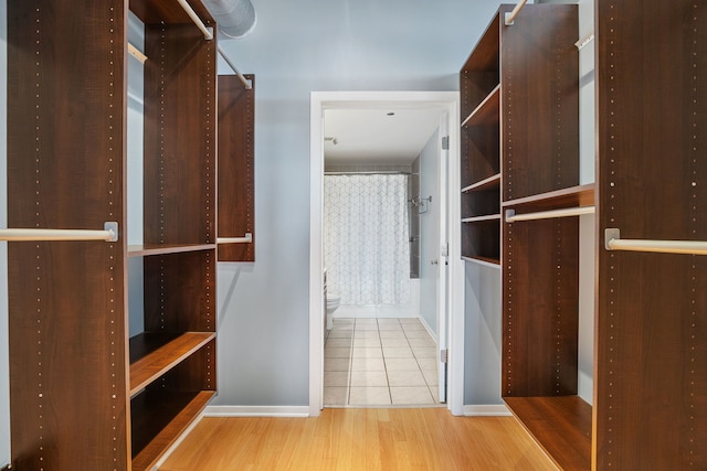 spacious closet with wood finished floors