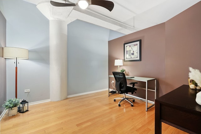 home office with wood finished floors, ceiling fan, and baseboards