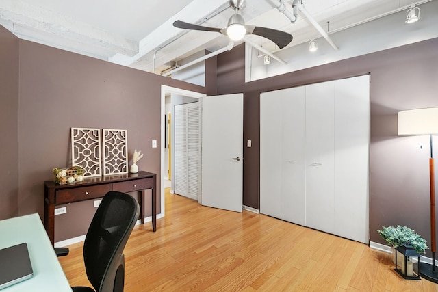office area with rail lighting, ceiling fan, light wood-style floors, high vaulted ceiling, and beam ceiling