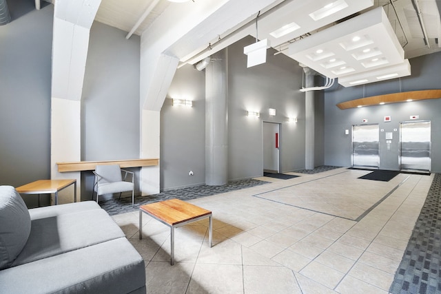 community lobby featuring a towering ceiling