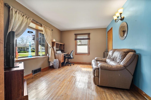 304 W Elm St, Fairbury, IL 61739 - living area featuring hardwood / wood-style flooring, an office area, and baseboards