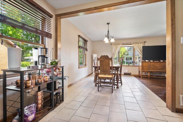 304 W Elm St, Fairbury, IL 61739 - dining room featuring tile patterned flooring, a chandelier, and baseboards