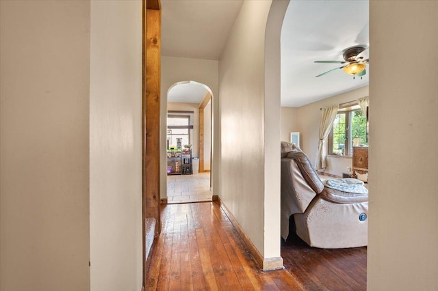 304 W Elm St, Fairbury, IL 61739 - corridor featuring arched walkways, hardwood / wood-style floors, and baseboards