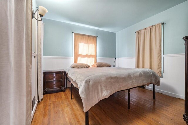 304 W Elm St, Fairbury, IL 61739 - bedroom featuring wood finished floors and wainscoting