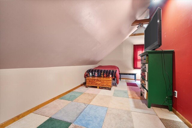 304 W Elm St, Fairbury, IL 61739 - bedroom featuring vaulted ceiling and baseboards