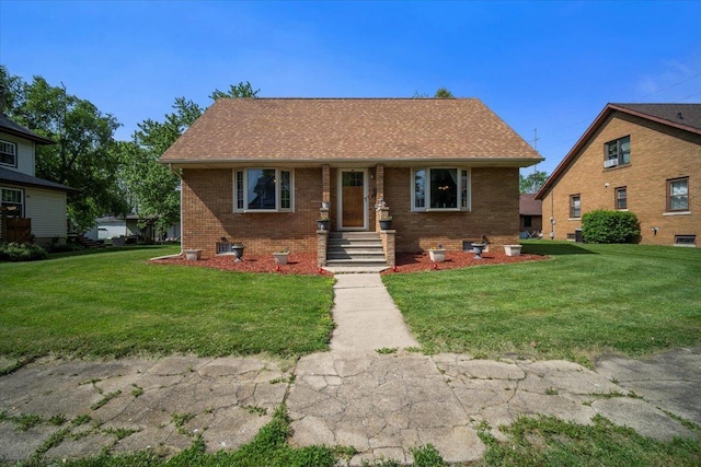304 W Elm St, Fairbury, IL 61739 - view of front facade featuring a front yard and brick siding