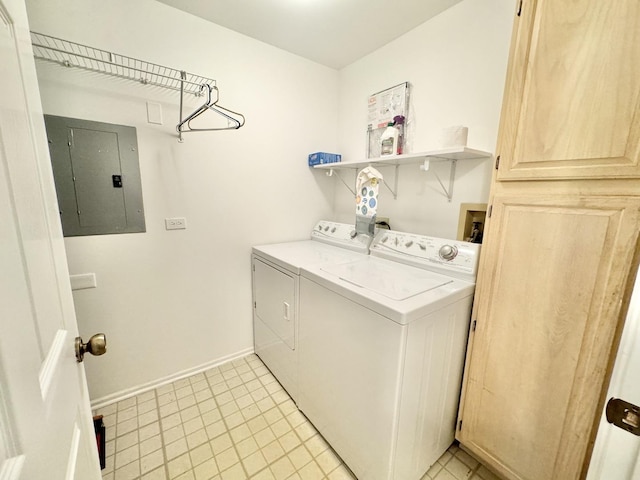 laundry area featuring electric panel, laundry area, separate washer and dryer, light tile patterned floors, and baseboards
