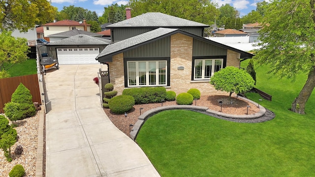 4690 W 130th Ct, Alsip, IL 60803 - view of front of property with a shingled roof, driveway, a chimney, brick siding, and an attached garage