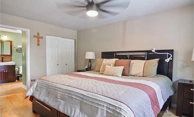 4690 W 130th Ct, Alsip, IL 60803 - bedroom with a closet, light wood-type flooring, a sink, and a ceiling fan