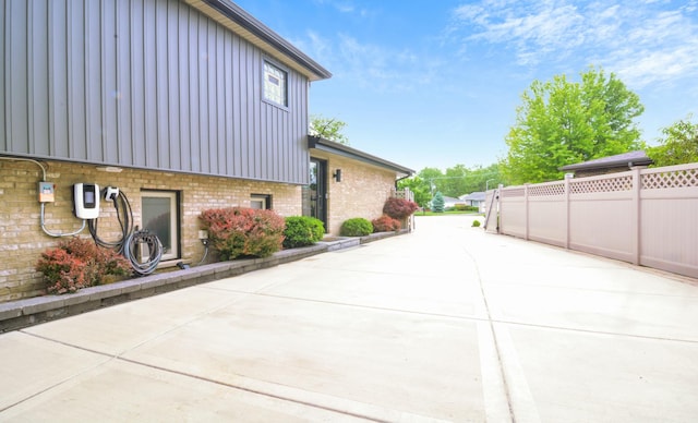 4690 W 130th Ct, Alsip, IL 60803 - view of side of property with brick siding, a patio, and board and batten siding