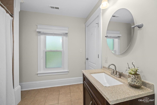 759 E Wilson St, Batavia, IL 60510 - full bathroom with tile patterned floors, vanity, and baseboards