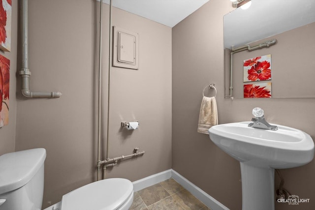 759 E Wilson St, Batavia, IL 60510 - half bathroom featuring toilet and baseboards