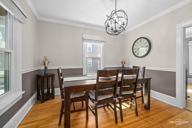 759 E Wilson St, Batavia, IL 60510 - dining area featuring a chandelier, light wood-style flooring, crown molding, and baseboards