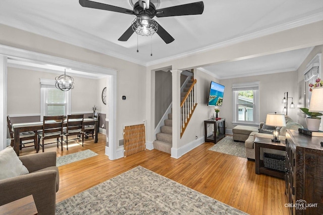 759 E Wilson St, Batavia, IL 60510 - living room featuring light wood-type flooring, ceiling fan, crown molding, stairway, and baseboards