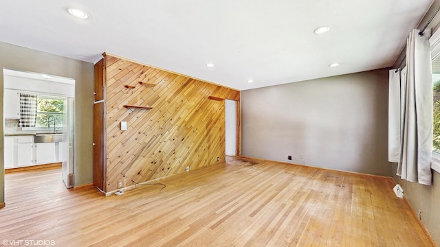121 Northern Ter, Island Lake, IL 60042 - empty room featuring wood walls, wood finished floors, recessed lighting, and an accent wall