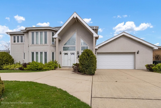 5657 N Crescent Ave, Norwood Park, IL 60631 - view of front of home featuring an attached garage, stucco siding, and driveway