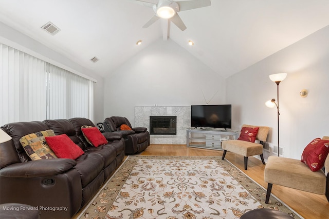5657 N Crescent Ave, Norwood Park, IL 60631 - living room with wood finished floors, a fireplace, vaulted ceiling with beams, visible vents, and ceiling fan