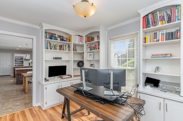 office space featuring ornamental molding and light wood-style floors