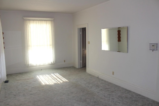 carpeted empty room with visible vents