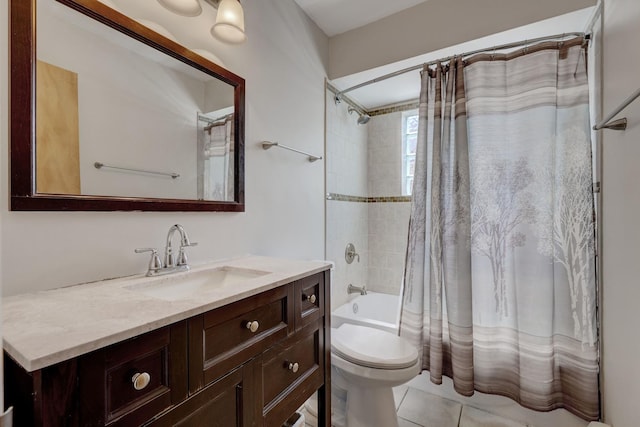 bathroom with toilet, vanity, shower / tub combo, and tile patterned flooring
