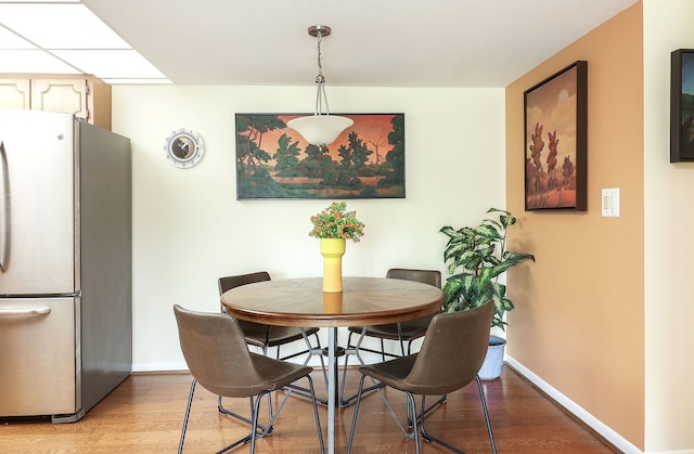 5300 Walnut Ave Unit 4D, Downers Grove, IL 60515 - dining room with light wood finished floors and baseboards