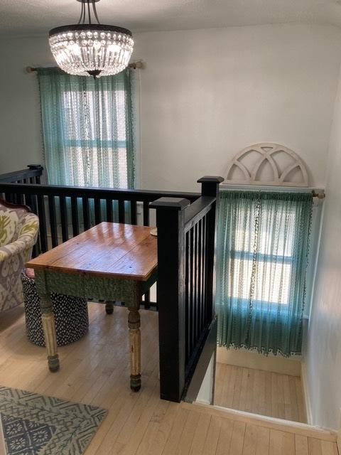 dining area with a chandelier and wood-type flooring