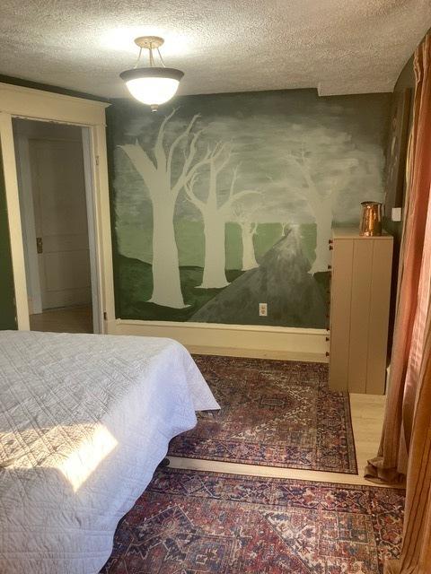 bedroom featuring a textured ceiling