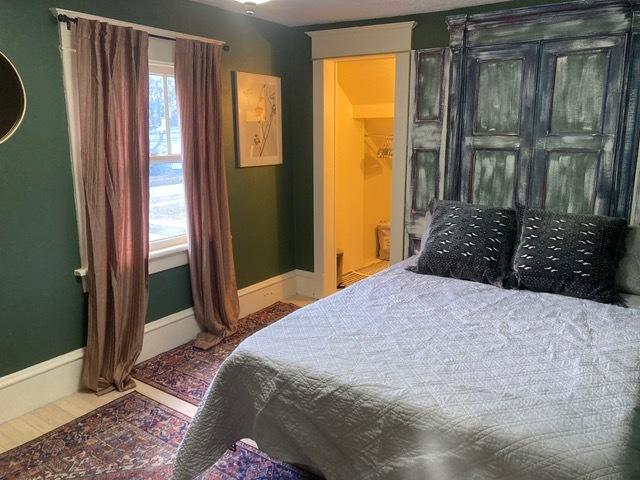 bedroom featuring baseboards